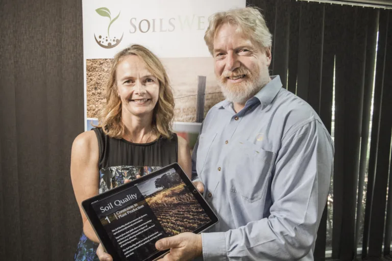 SoilsWest Co-Directors Fran Hoyle and Chris Gazey with the first Soil Quality ebook: Constraints to Plant Production.