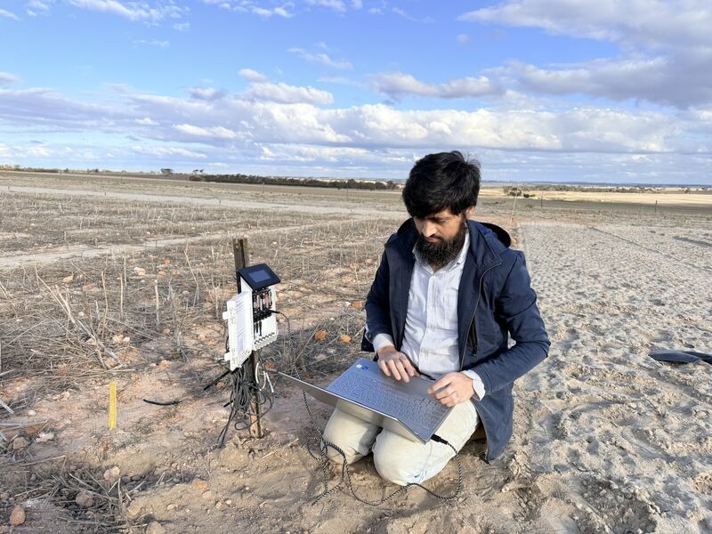 Dr Hassan Sardar works with a soil moisture sensor at Bullaring