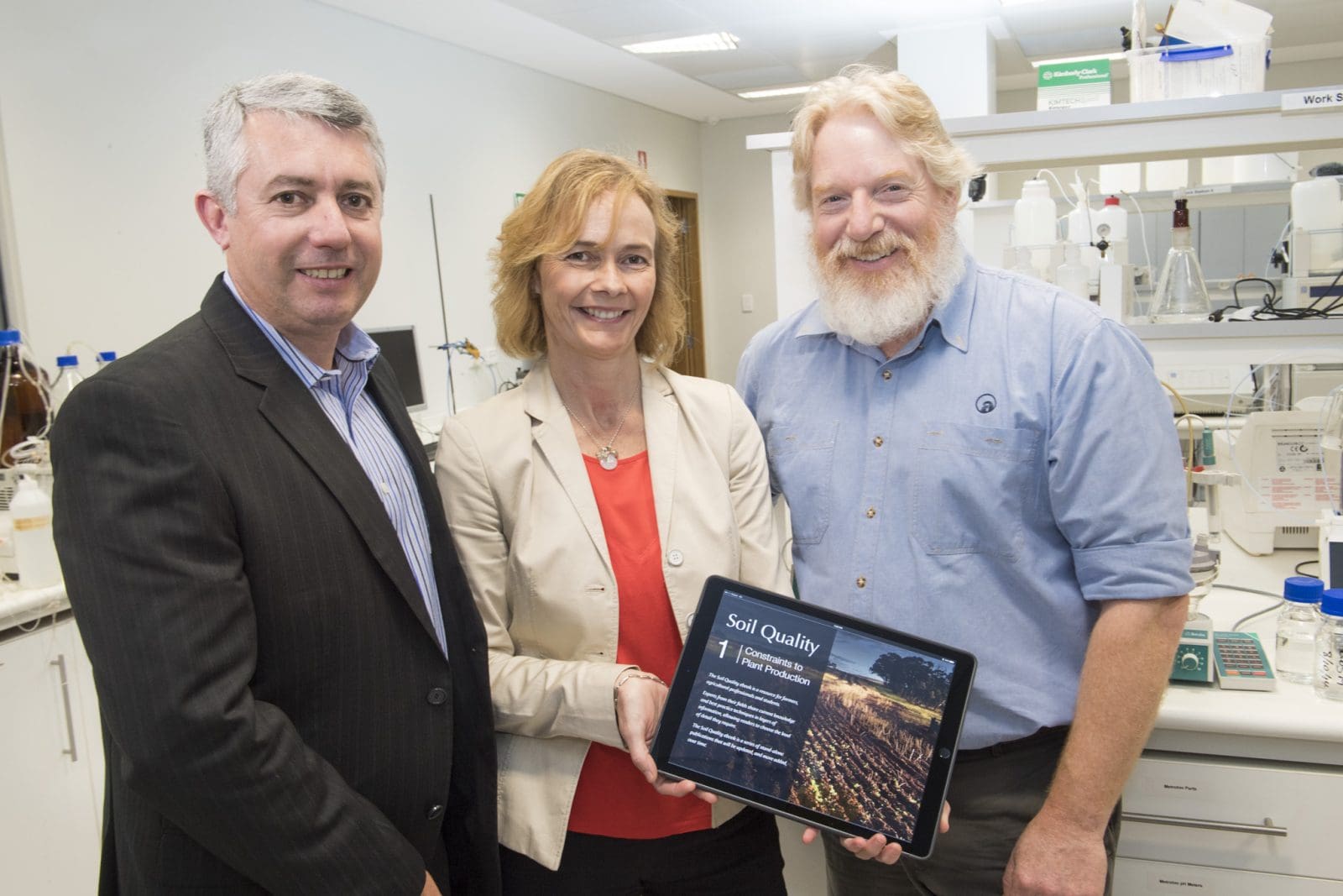 Professor Daniel Murphy, Dr Fran Hoyle and Chris Gazey pictured with Soil Quality ebook 1 Constraints to Plant Production in 2016. (Credit: DPIRD.)